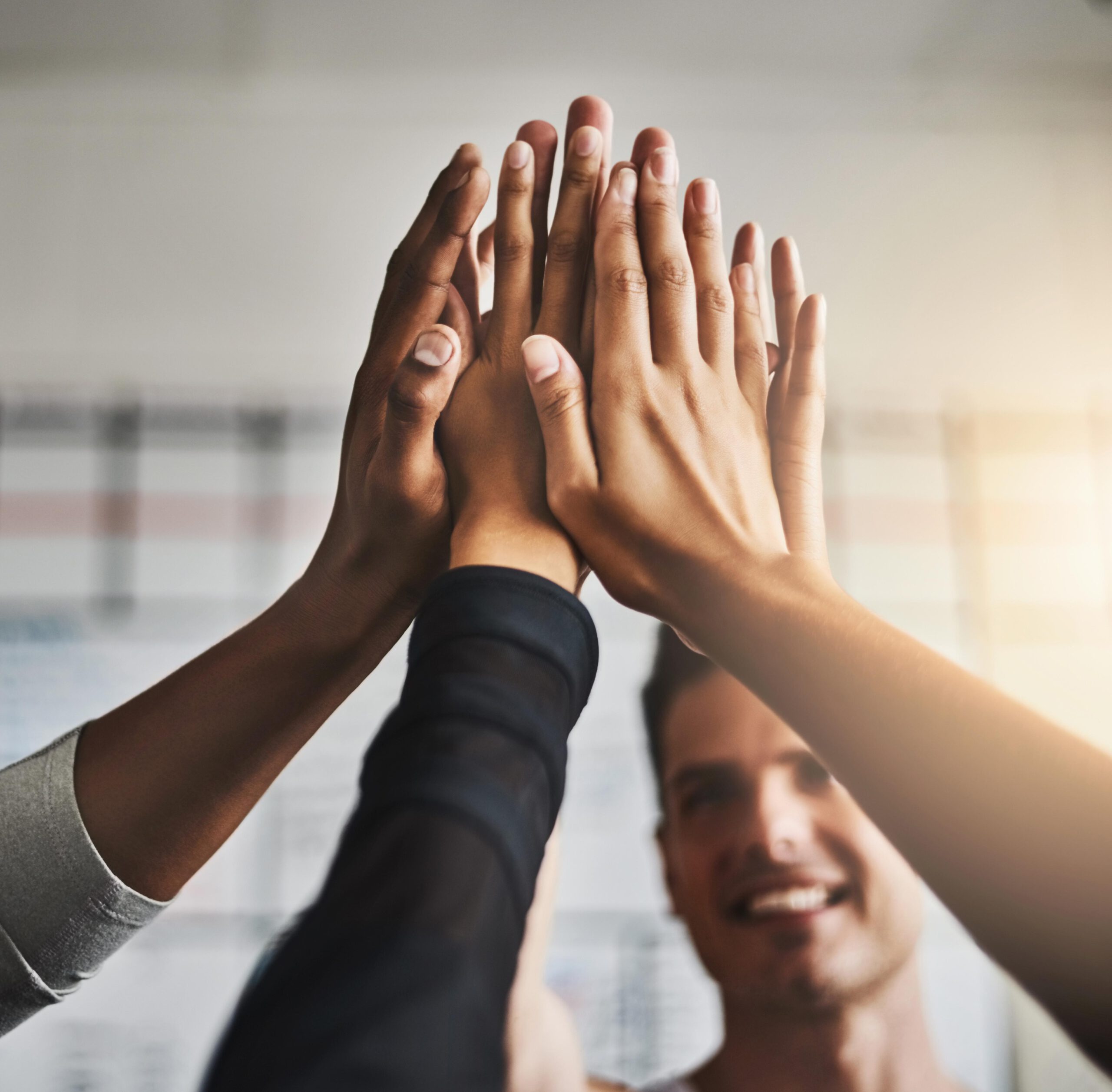 Fitness, success and high five of people in gym for motivation, support and target. Workout, exercise and training with hands of friends in sports center for team building, challenge and achievement.